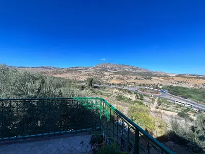 a balcony with a view of a mountain at Fès Riad Scalia Traditional Guesthouse Morocco in Fès