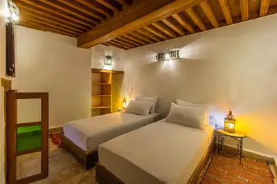 a bedroom with two beds in a room at Dar Bhija in Fès