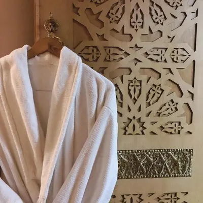 a towel hanging on a rack in a bathroom at Aparthotel Les Oliviers Suites & Spa in Fès