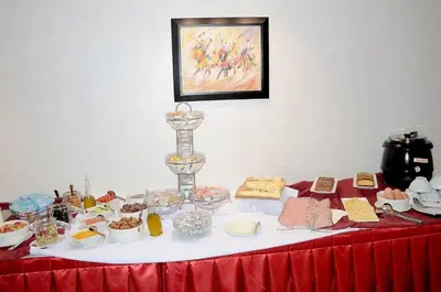 a table with a bunch of food on it at Hôtel l'escale in Fès