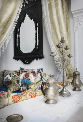 a table with a mirror and a tea kettle on it at Riad Dar Arsama in Fès