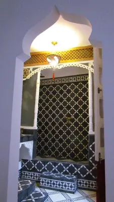 a room with a wall with a blue and white tile at Riad Dar Arsama in Fès