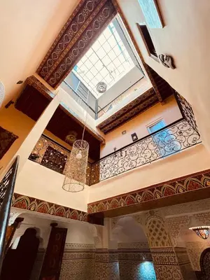 a room with a ceiling with a chandelier at la Kasbah salam in Fès