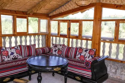 a living room with couches and a coffee table at La pommeraie d'Ifrane in Ifrane