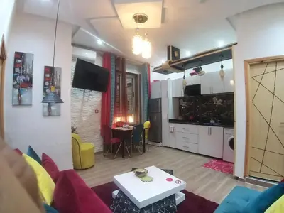 a living room with a couch and a table at Ryan 1 in Fès