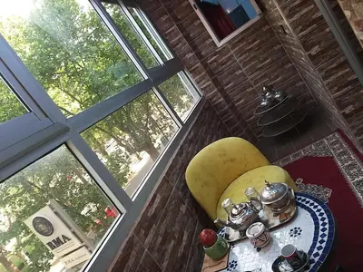 a room with a table and a window at Ryan 1 in Fès
