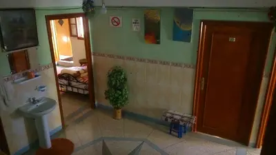 a small bathroom with a sink and a toilet at Hotel Imilchil in Zaouiat Cheikh