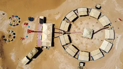an overhead view of an island in the water at Aladdin Desert Camp - Mhamid Erg Chigaga Escape in El Gouera