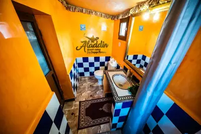 an overhead view of a bathroom with a toilet at Aladdin Desert Camp - Mhamid Erg Chigaga Escape in El Gouera