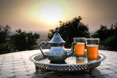 two glasses of beer and a tea pot on a tray at Le Douar Berbere in Ourika