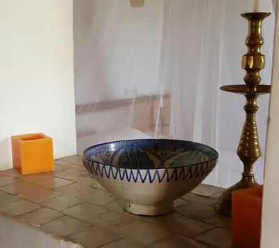 a large bowl sitting on a tile floor in a room at Le Douar Berbere in Ourika
