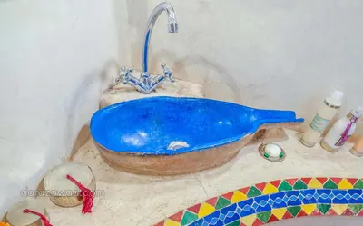 a blue bath tub with a faucet on a counter at Dar Azawad Boutique Hotel - Mhamid Sahara Stay in Mhamid