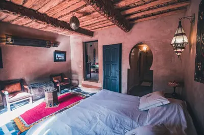 a bedroom with a bed in a room at Dar Azawad Boutique Hotel - Mhamid Sahara Stay in Mhamid