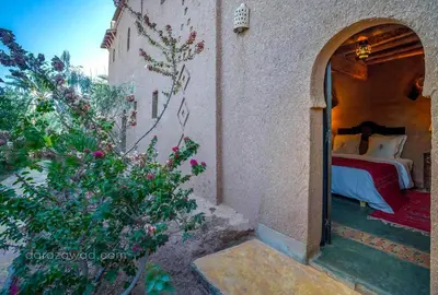 a bedroom in a house with a bed in it at Dar Azawad Boutique Hotel - Mhamid Sahara Stay in Mhamid