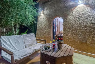 a couch and a coffee table on a patio at Dar Azawad Boutique Hotel - Mhamid Sahara Stay in Mhamid