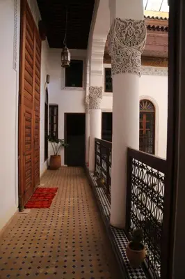 a hallway of a house with a door at Riad Jamaï in Fès