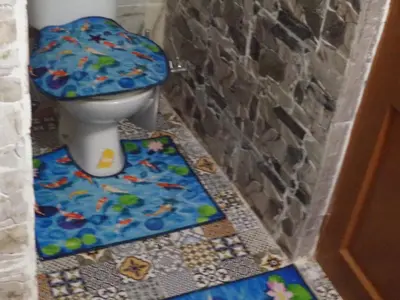 a bathroom with a toilet with a mosaic floor at Dar Nouzha A in Fès