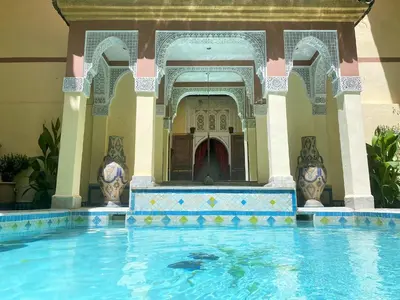 a swimming pool in the middle of a building at Riad Zitouna in Fès