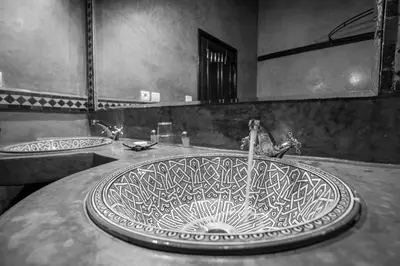 a sink in a bathroom with two sinks at Riad Zitouna in Fès
