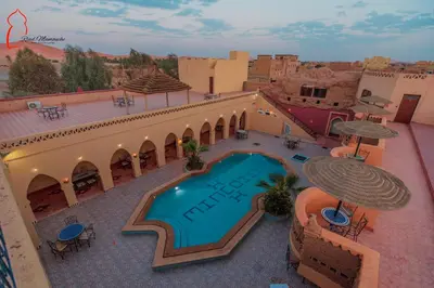 an overhead view of a hotel with a swimming pool at Riad Mamouche in Merzouga