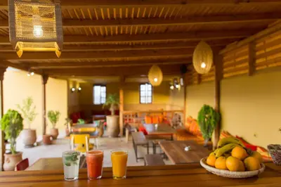 a room with a table with fruit and drinks on it at Medina social club in Fès
