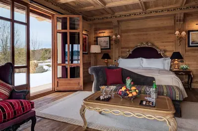 a bedroom with a bed and a table with fruit on it at Michlifen Resort & Golf in Ifrane