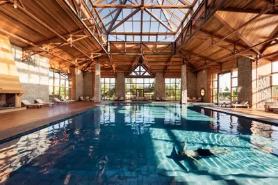 a large indoor swimming pool with a large ceiling at Michlifen Resort & Golf in Ifrane