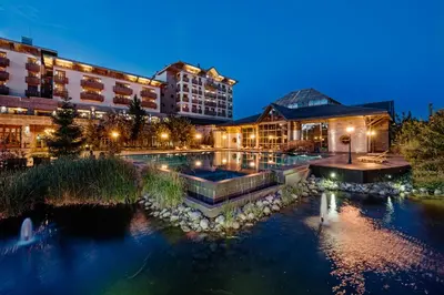 a hotel with a pool in front of a building at Michlifen Resort & Golf in Ifrane