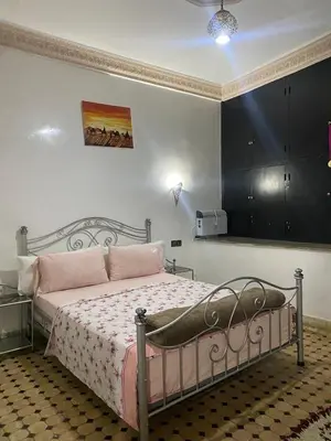 a bedroom with a bed with a fish bowl on it at dar hassbia in Fès