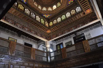 a view of a building with a ceiling with stained glass at Palais AL Firdaous in Fès