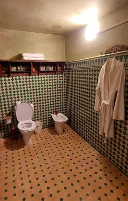 a bathroom with a toilet and a bidet at Palais AL Firdaous in Fès
