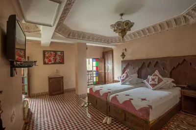 a bedroom with a large bed in a room at Riad Salam Fes & Spa in Fès