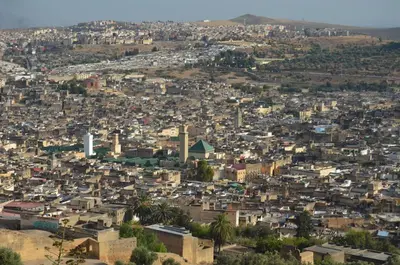 an aerial view of a city with buildings at Riad Diwan in Fès