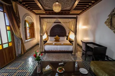 a bedroom with a bed in a room at Palais Houyam in Fès