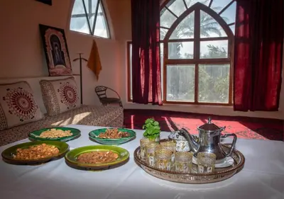 a table with several plates of food on it at Bassatine Skoura in Skoura