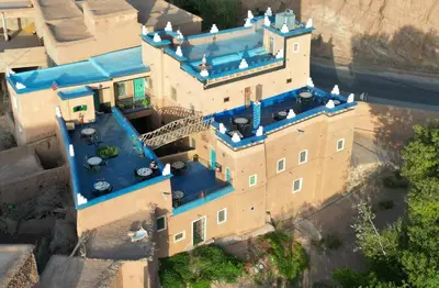 an overhead view of a castle with blue roof at Labyrinth Kasbah Dades in Ait Ben Ali