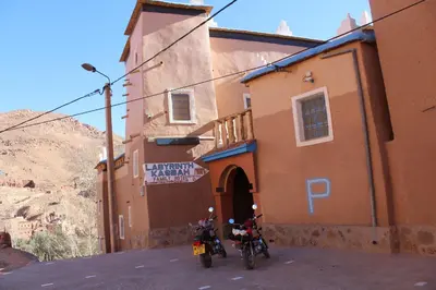 two motorcycles parked in front of a building at Labyrinth Kasbah Dades in Ait Ben Ali