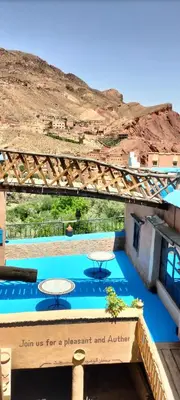 a sign that readsjoin us for a placement and auditorium at Labyrinth Kasbah Dades in Ait Ben Ali