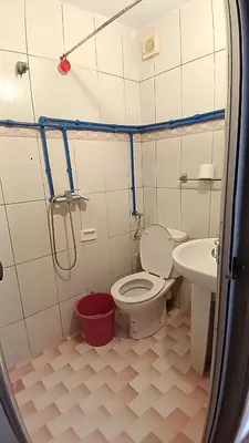 a bathroom with a toilet and a sink at Residence Rosas in Ouarzazate