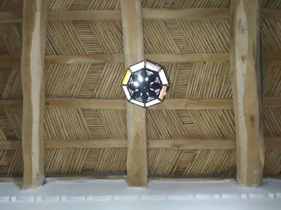 a room with a ceiling with a glass fixture at Hotel Restaurant Camping Berbère de la Montagne in Imdiazene