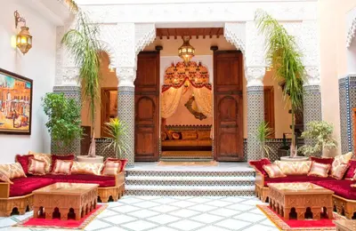 a lobby with couches and tables in a building at Riad-Boutique Borj Dhab Fez in Fès