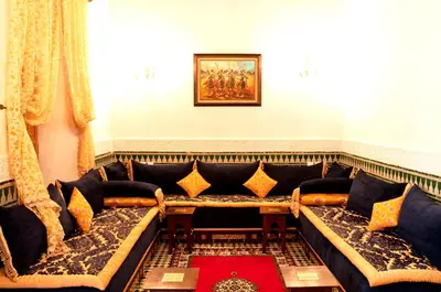 a living room with a large couch in a room at Riad-Boutique Borj Dhab Fez in Fès