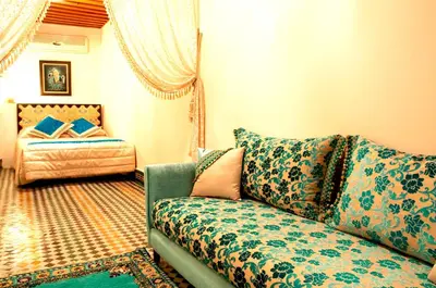 a living room with a couch and a bed at Riad-Boutique Borj Dhab Fez in Fès