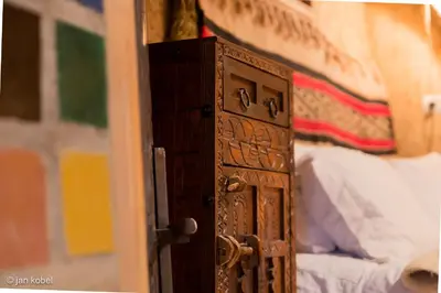 an open door to a bedroom with a bed at Dar KamalChaoui in Bhalil