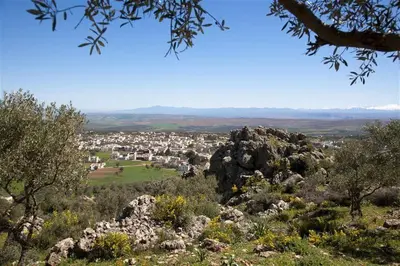 a view of a city from the top of a hill at Dar KamalChaoui in Bhalil