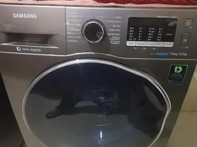 a close up of a washing machine with its door open at Chalet Asmoun in Imouzzer Kandar