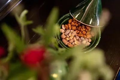 a container filled with food next to some flowers at Hôtel Riad Dar Daïf in Ouarzazate