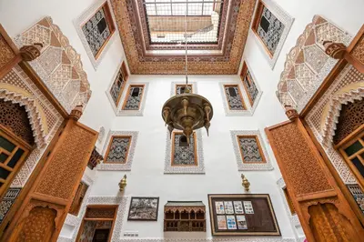 a view from the ceiling of a building with a fountain at Riad Eloria Fes in Fès
