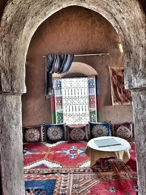 a living room with a couch and a table at Kasbah Oulad Othmane in Agoubt