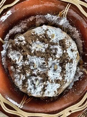 a plate of food with powdered sugar on it at Kasbah Oulad Othmane in Agoubt